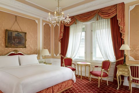 Our red king guest room stands for coziness.